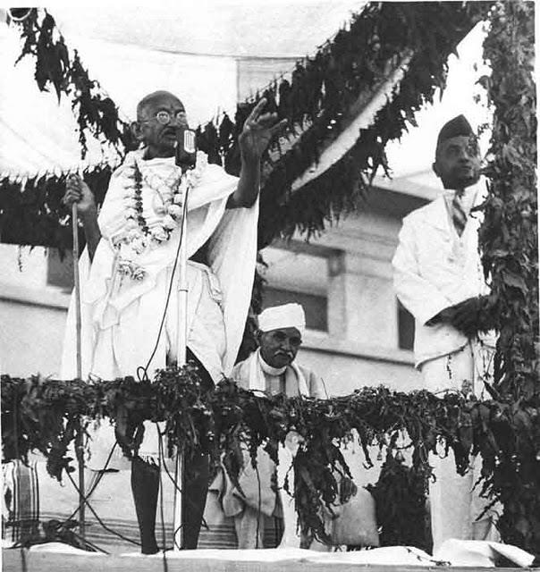 Mahatma-Gandhi-performing-the-opening-ceremony-of-Kamla-Nehru-Hospital-in-Allahabad-in-1941.-Pandit-Mahan-Mohan-Malavaya-is-Seated-next-to-him-and-Dr.-Jivaraj-Mehta-is-seen-standing-on-the-extreme-right