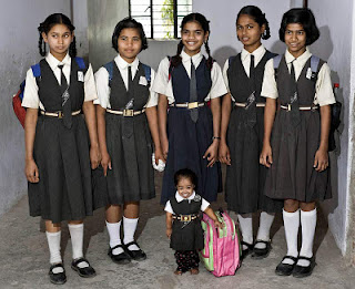 Jyoti Amge is in the school with her school mates