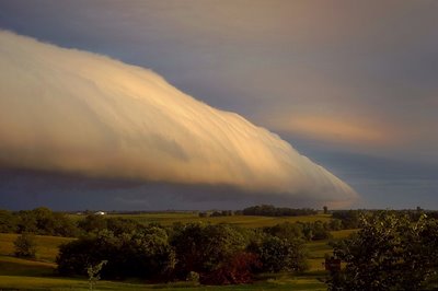 roll-cloud-passing-over-a-green-field