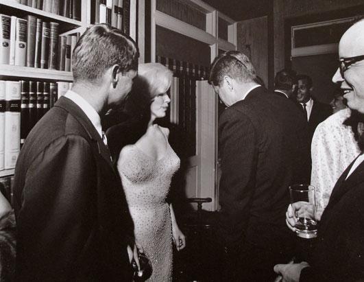 One of very few photographs showing Marilyn Monroe with John and Robert Kennedy. JFK held a democratic fundraiser on May 19, 1962 at the Manhattan home of Arthur and Mathilde Krim (Cecil W. Stoughton/Bonhams)