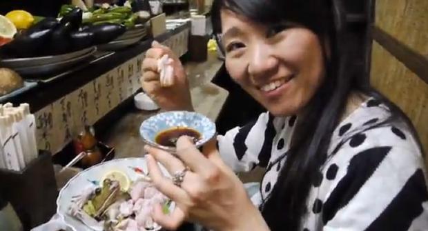 A-Japanese-woman-eating-live-frog